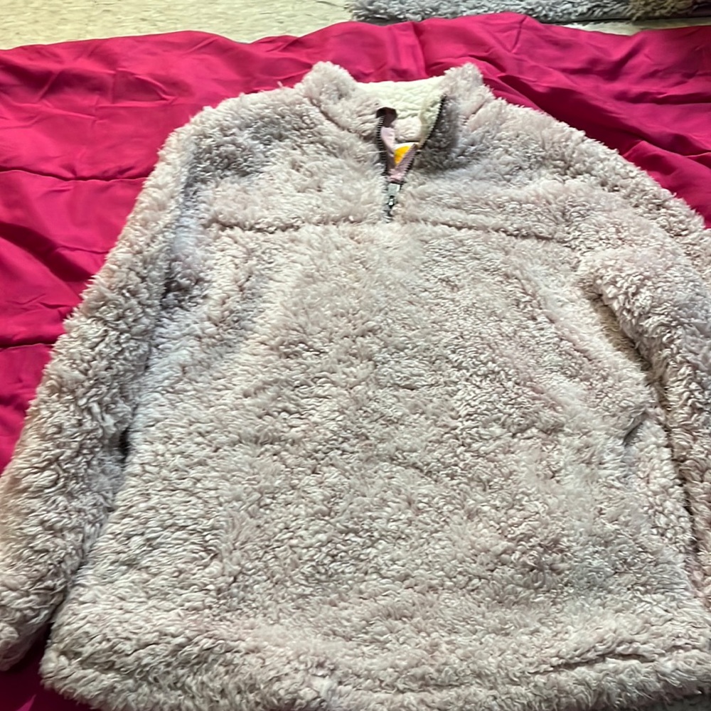 Girls sweater is light pink very soft